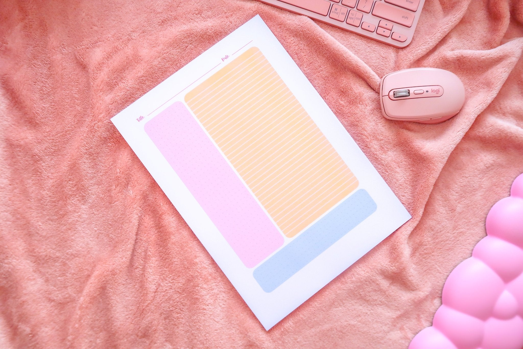 A top down view of Totepad's Cornell Notes Bubblegum Cute Notepad on a fuzzy warm pink throw.