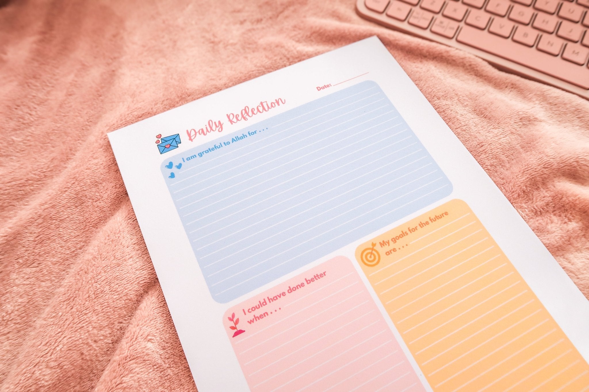 Totepad's Bubblegum Daily Reflection Notepad on a warm fuzzy pink blanket.