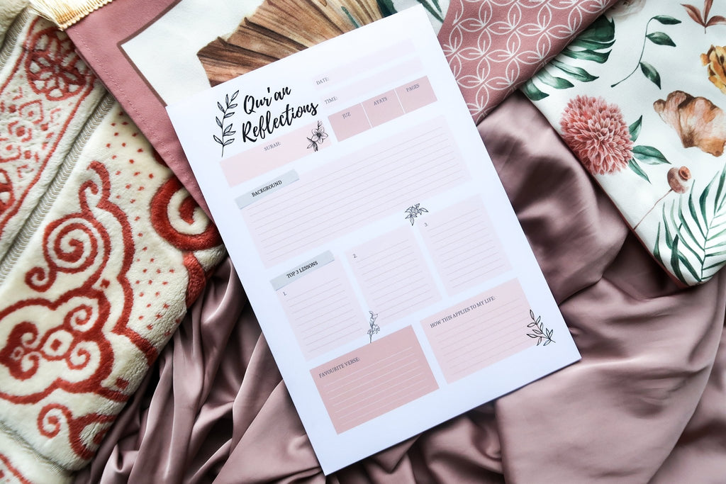 A top down full view of Totepad's Quran Reflections Notepad on a pastel pink prayer mat.